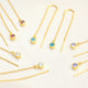 Gold birthstone threaders with Garnet/Jan, Blue Topaz/December, Amethyst/Feb and Clear/April birthstones shown close up 