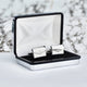 Lucky clover cufflinks shown in silver chrome rectangle cufflinks box