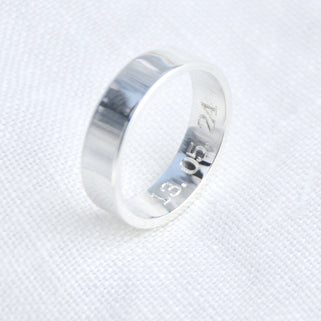 Personalised Unisex Silver Band Ring shown close up showing engraving on inside