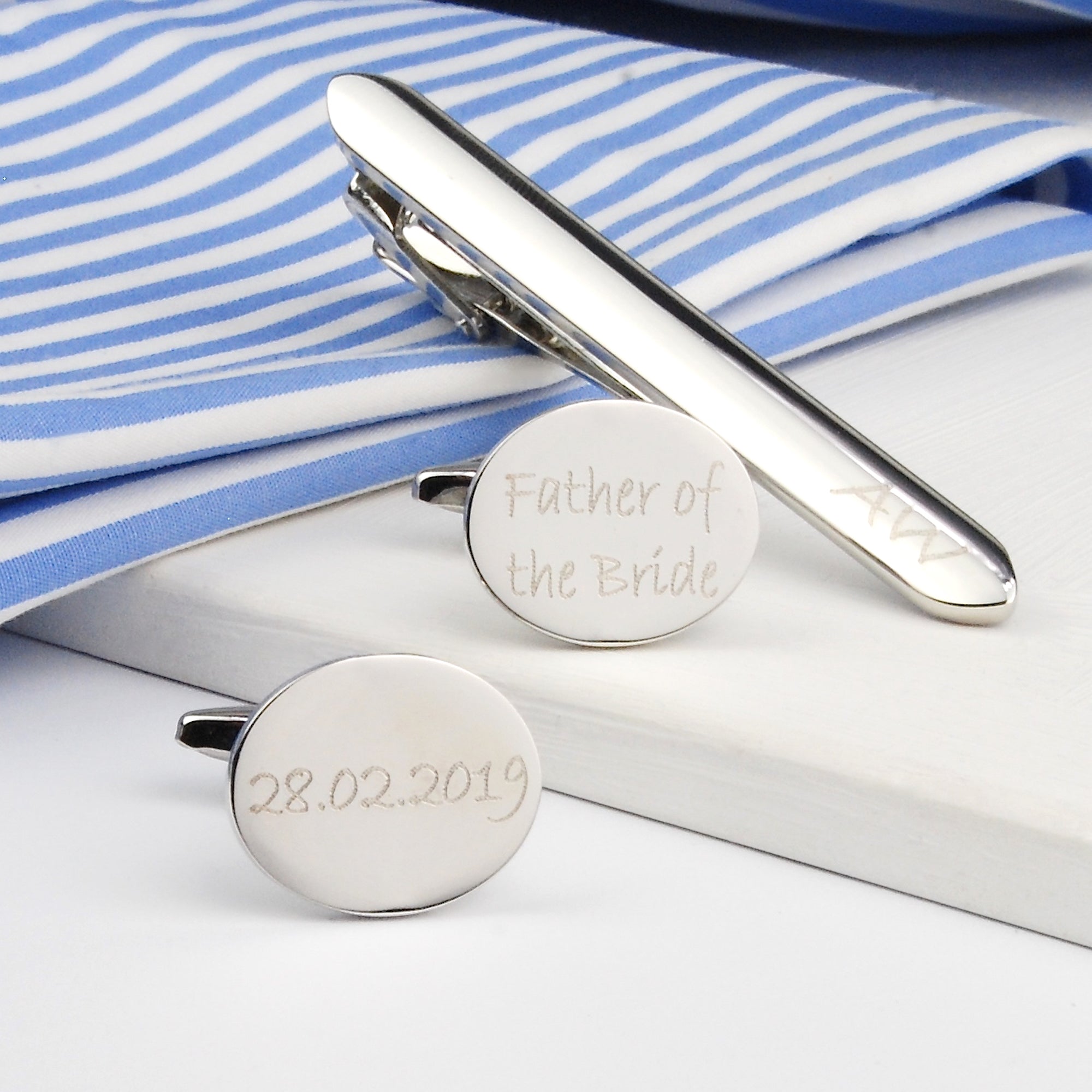 silver cufflinks and tie clip set