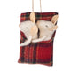A hanging felt ornament featuring two white pigs nestled inside a red and green plaid fabric pouch, suspended by a natural jute string against a plain white background.