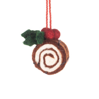 A felt Christmas ornament shaped like a swirled cake roll, with green leaves, red berries, and a red hanging string, shown on a plain white background.