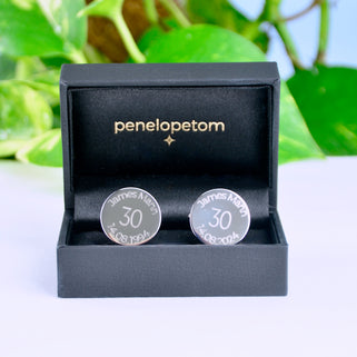 Milestone 30th year birthday cufflinks with personalise name and date engraved around the top and bottom shown in black Penelopetom cufflinks box.