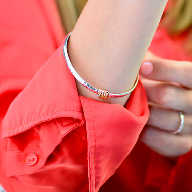 Solid Sterling Silver Five Rings 50th Birthday Bangle shown close up on model