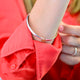 Solid Sterling Silver Five Rings 50th Birthday Bangle shown close up on model