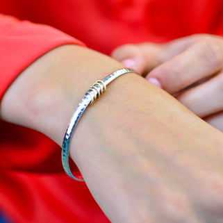 Solid Sterling Silver Five Rings 50th Birthday Bangle shown in close up with 5 rings detailing