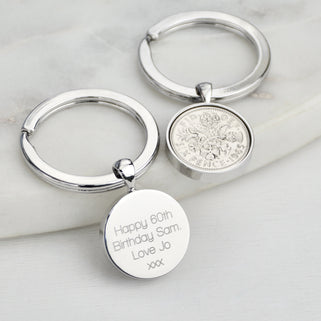 60th Sixpence Keyring shown with message engraved on the back in straight walk font.