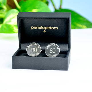 Personalised milestone 80th birthday cufflinks shown in black Penelopetom gift box