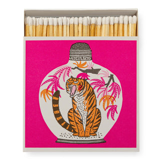 pink square match box with tiger design on the front