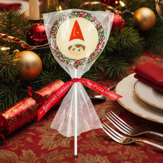 Decorative Christmas cracker with a gnome design on a festive table setting.