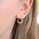 Sterling Silver Organic Twist Hoop Earrings shown close up on model
