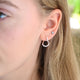 Sterling Silver Organic Twist Hoop Earrings shown close up on model