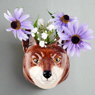 Decorative wall vase fox head with flowers on a white background