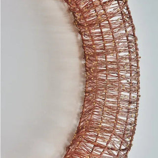 Rose gold decorative wreath on a white background