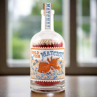 goldfish design glass bottle of large red matches