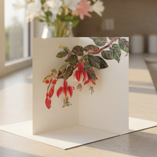 A 3D pop-up greeting card with a fuchsia bouquet design, displayed with a white envelope.