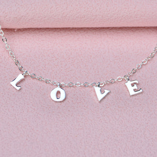 Close up of love charm bracelet