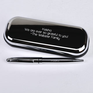 Silver chrome pen with matching case with "Keisha We are so grateful to you! - The Webster Family" engraved in straight walk font shown close up shot
