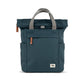 Blue backpack with gray handle on a white background