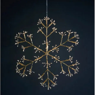 Decorative snowflake light fixture on a dark background