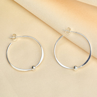 Sterling Silver large Hoop Earrings With Beads shown close up .