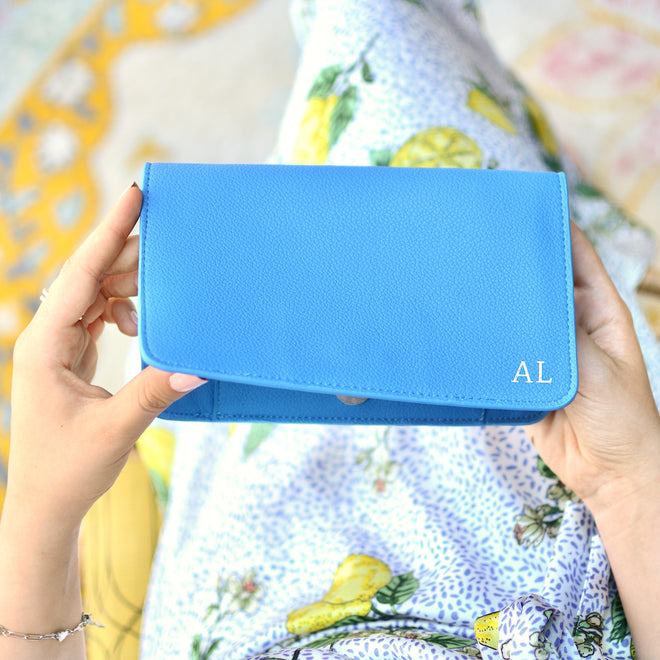 Royal Blue Personalised Carry All Travel Wallet with Card Holder Purse shown in overhead shot held by model