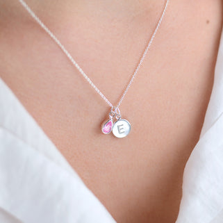 Personalised Silver Initial Teardrop Birthstone Necklace shown close up on model