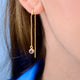 Gold birthstone threader with Amethyst/Feb birthstone shown close up on model