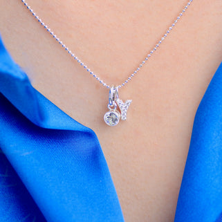Initial Y Sparkle Initial with April Clear Birthstone Necklace shown close up on model