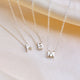 Girls slider inital necklace  shown close up with letters A, B and M on a fine silver chain