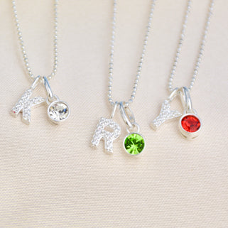 Birthstone necklaces with Sparkle Initial Letter - Initial K with April clear birthstone, Initial R with May Emerald birthstone, Initial Y with July Ruby birthstone