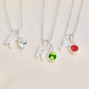 Birthstone necklaces with Sparkle Initial Letter - Initial K with April clear birthstone, Initial R with May Emerald birthstone, Initial Y with July Ruby birthstone