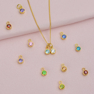 Selection of Gold Vermeil Birthstone Charm  shown close up