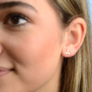 Gold Vermeil Mini Star Cluster Stud Earrings shown close up on model