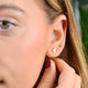 Gold Lightening Bolt Stud Earring shown in close up shot on model
