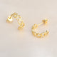 Gold open heart hoop earrings shown close up