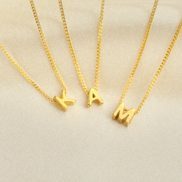 Personalised Gold Mini Slider Initial Charm Necklace letter K A and M shown close up