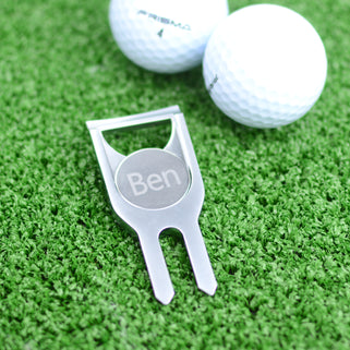 Personalised golf marker and bottle opener shown close up in polished silver finish