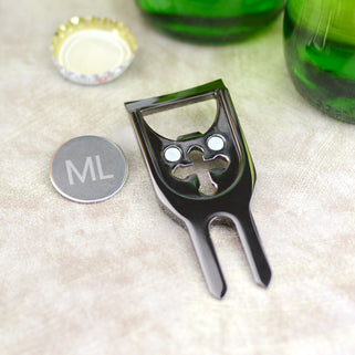 Personalised golf marker and bottle opener shown close up in gunmetal finish showing ball marker with ML initials