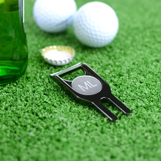 Personalised golf marker and bottle opener shown close up in gunmetal finish