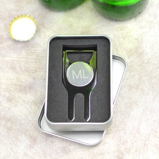 Personalised golf marker and bottle opener shown close up in gunmetal finish