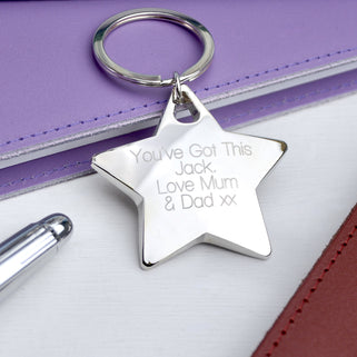 Silver star keyring with "You've got This Jack. Love Mum & Dad xx" engraved on the front shown in close up shot.