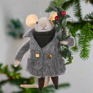 Felted mouse ornament in a coat with holly leaves and berries on a white background