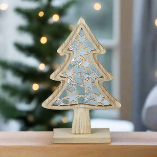 Wooden Christmas tree decoration with star patterns on a white background