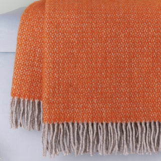 close up shot of orange illusion throw blanket