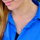 Modern Initial and birthstone necklace shown on model