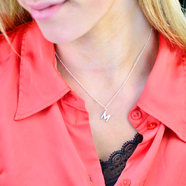 Sterling Silver Modern Initial Letter Necklace on satellite chain shown close up on model