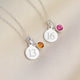 Silver landmark birthstone necklace shown close up with Citrine and Toumaline birthstone charms