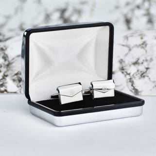 Lucky clover cufflinks shown in silver chrome rectangle cufflinks box