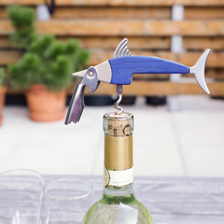 blue and silver metal fish shaped corkscrew with bottle opener